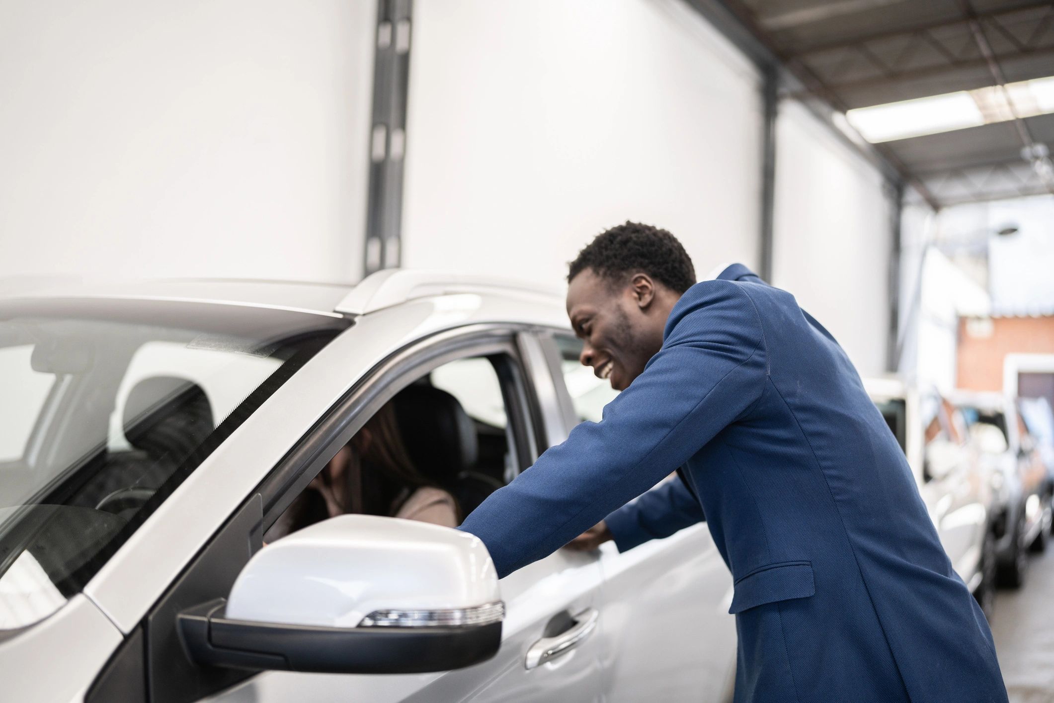 Customer discussing a vehicle with a service professional