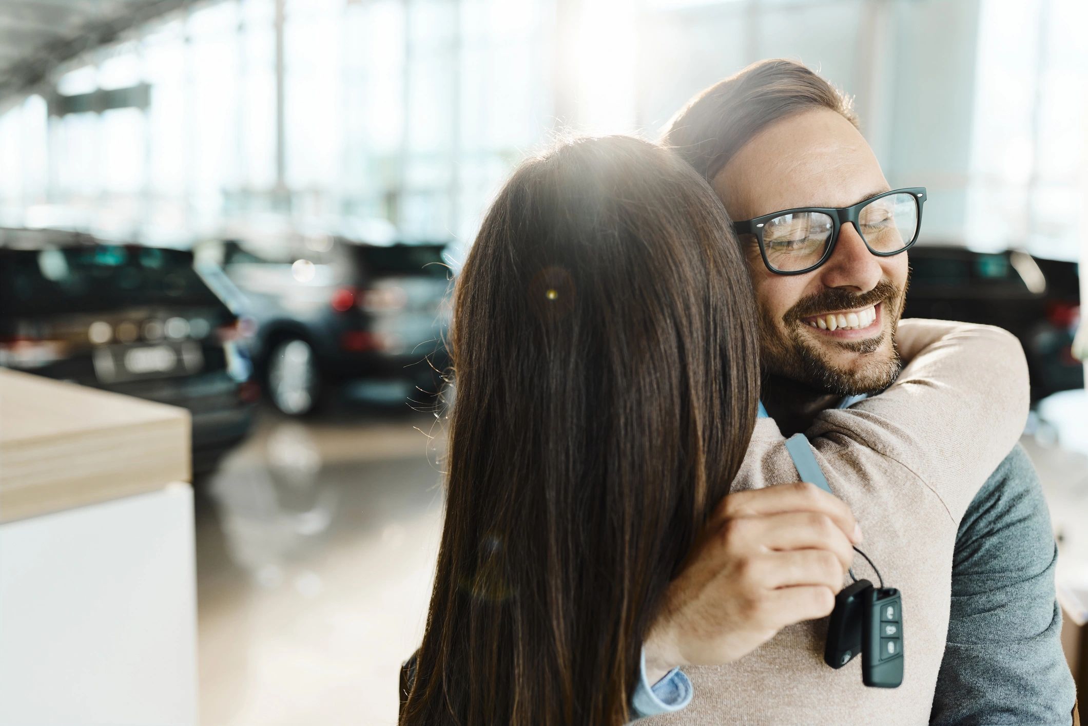 Happy couple holding car keys