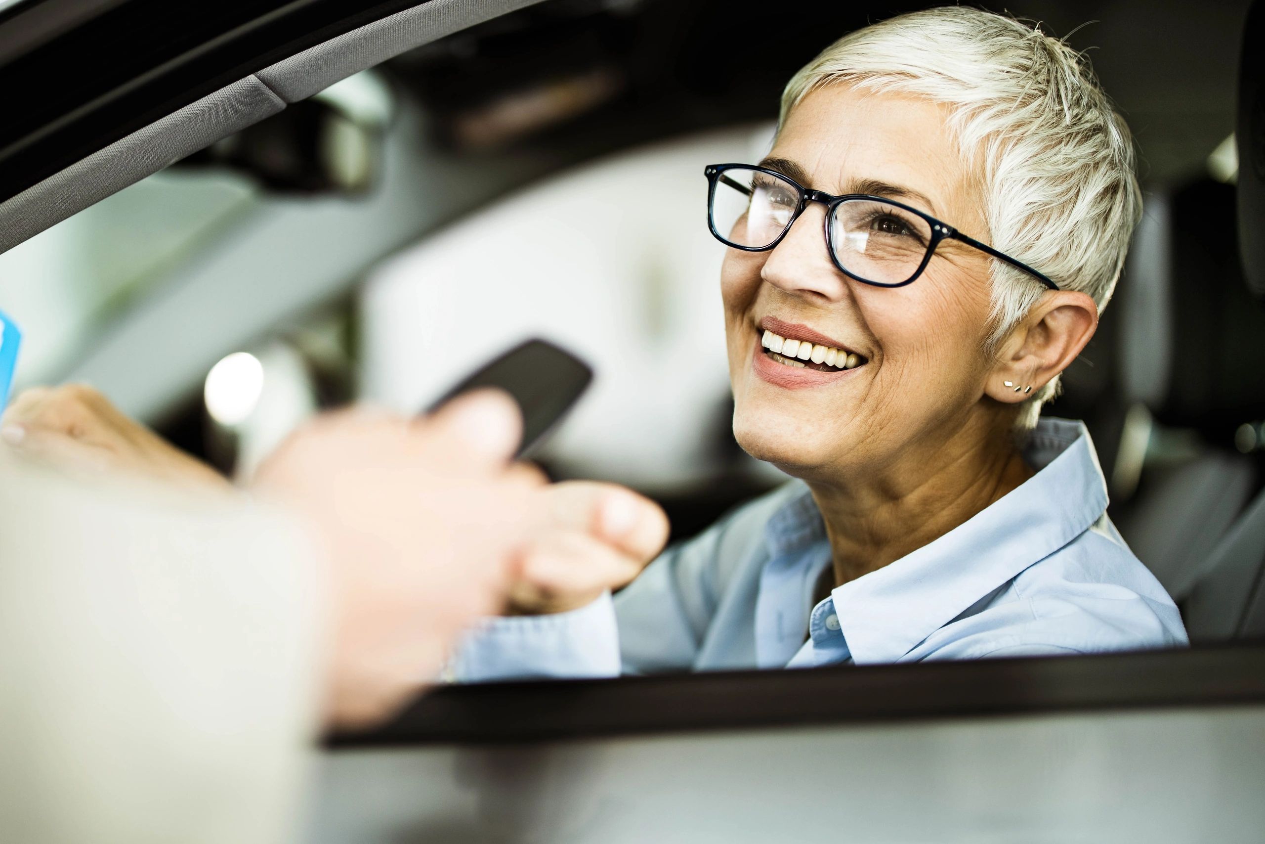 Happy customer holding car keys