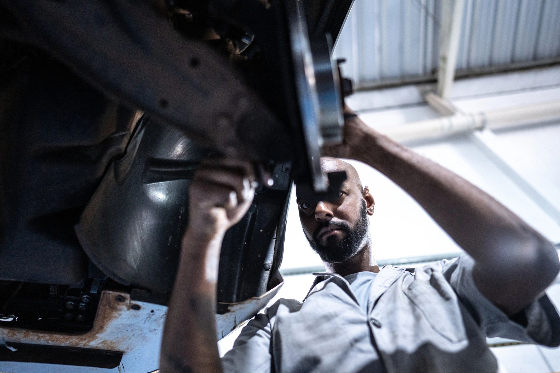 Mechanic working on a vehicle in a professional auto repair shop