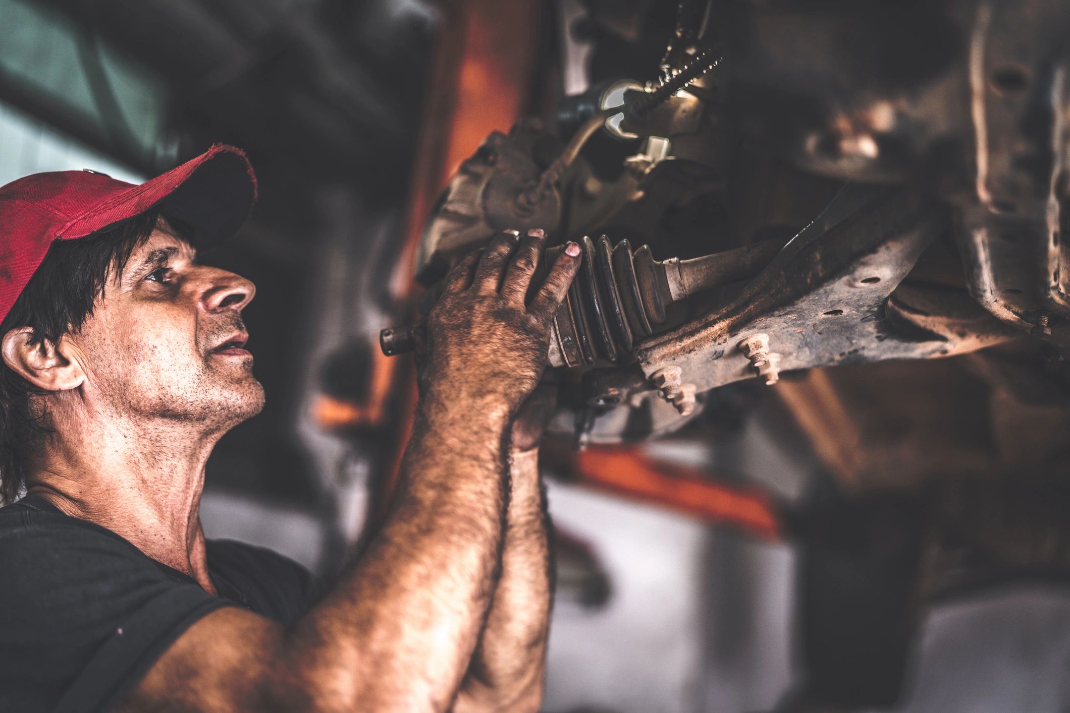 Professional mechanic working on a vehicle in an auto repair shop